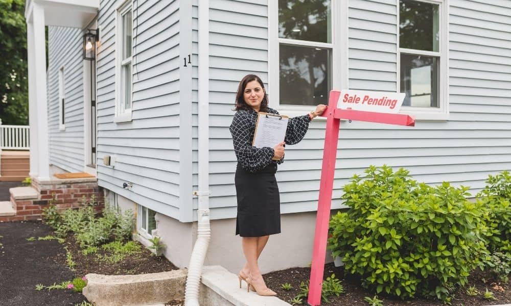 Home sale pending with property documents and a mortgage survey being reviewed before closing